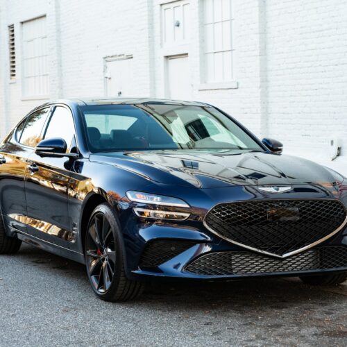 Genesis G70 3.3t parked street side by Mac's Chophouse in Marietta Square photographed from the passenger side front quarter panel.