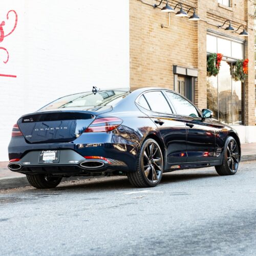 Genesis G70 3.3t parked street side by Mac's Chophouse in Marietta Square photographed from the passenger side rear quarter panel.