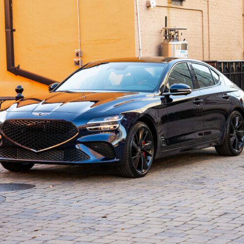 Genesis G70 3.3t in a colorful alley in Marietta Square photographed from the driver side front quarter panel.