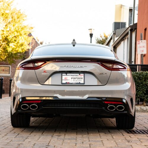 Kia Stinger in a colorful alley in Marietta Square photographed from the rear.