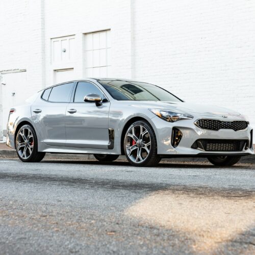 Kia Stinger parked street side by Mac's Chophouse in Marietta Square photographed from the passenger side front quarter panel.