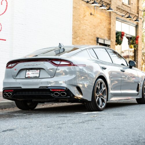 Kia Stinger parked street side by Mac's Chophouse in Marietta Square photographed from the passenger side rear quarter panel.