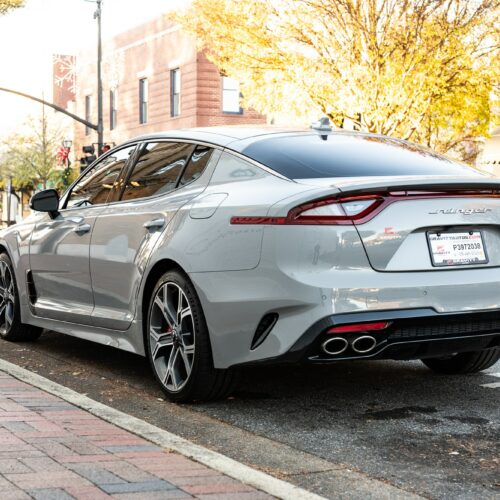 Kia Stinger parked street side by Mac's Chophouse in Marietta Square photographed from the driver side rear quarter panel.