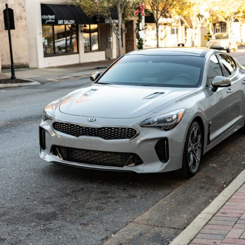 Kia Stinger parked street side by Mac's Chophouse in Marietta Square photographed from the driver side front quarter panel.