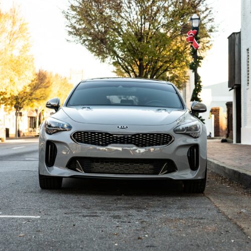 Kia Stinger parked street side by Mac's Chophouse in Marietta Square photographed from the front.