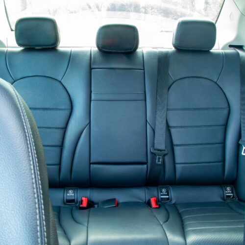 Rear seat of a Mercedes C-Class photographed from the front seat.